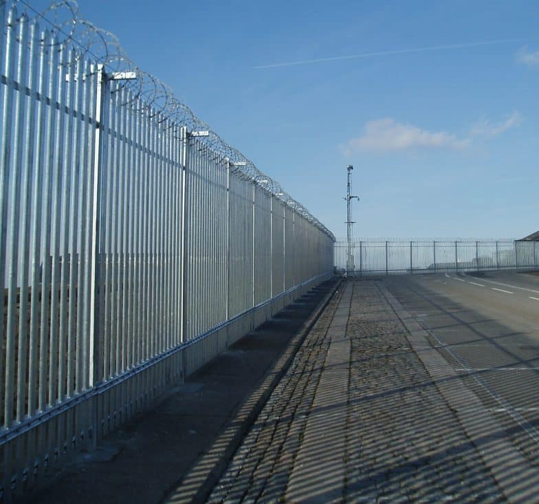 Robust palisade security fencing protecting an industrial site