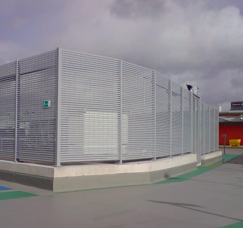 Architectural louvres providing ventilation and privacy for a building.