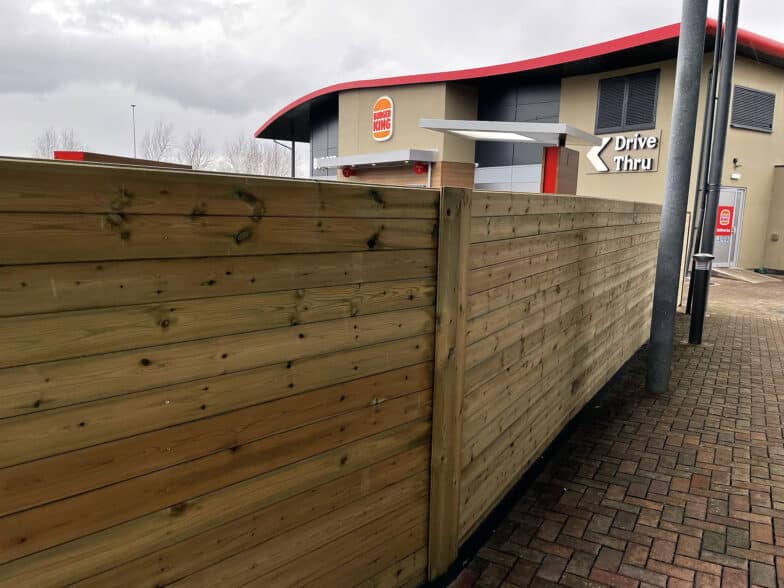 Procter's bespoke eco timber fencing at a drive-through in Cardiff